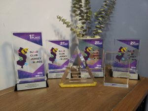 alt="3E Public Relations Awards on table"