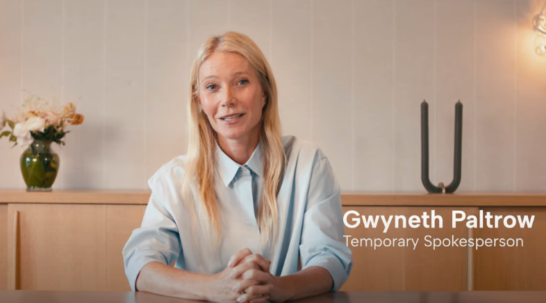 alt=Gwyneth-Paltrow-sitting-at-table